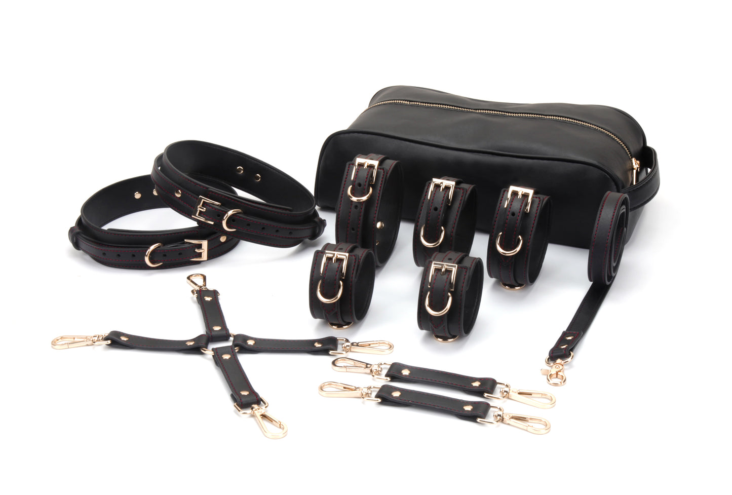 Luxury black vegan leather restraint collection with rose gold hardware, collar, cuffs, leash and under-bed restraint system.
