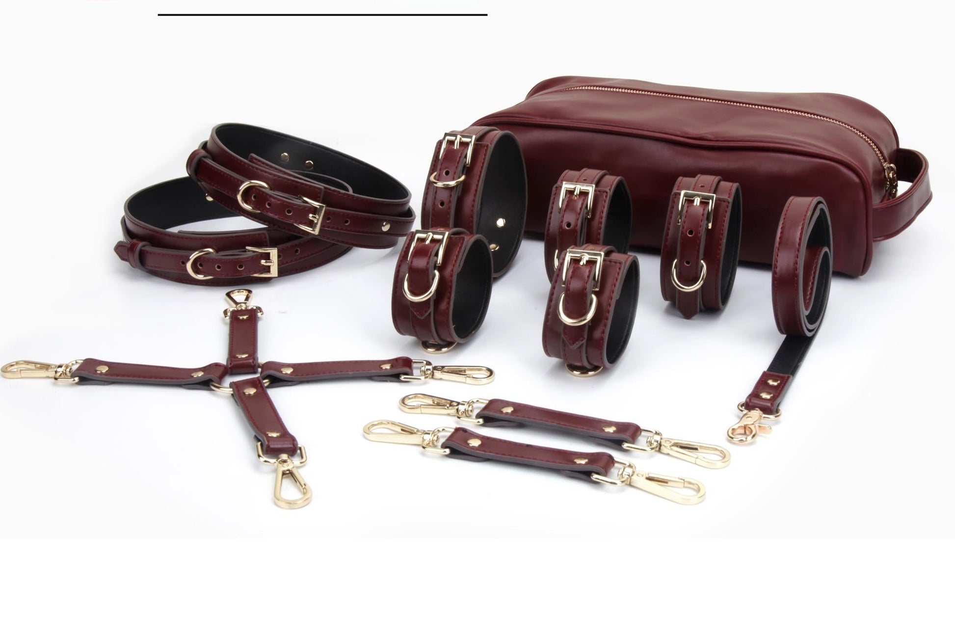 Luxury wine-red vegan leather restraint collection with rose gold hardware, collar, cuffs, leash and under-bed restraint system